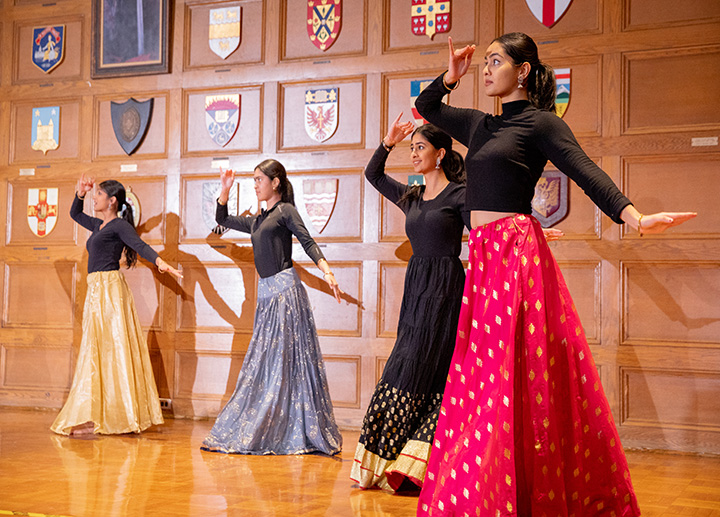 4 female students doing a cultural dance 
